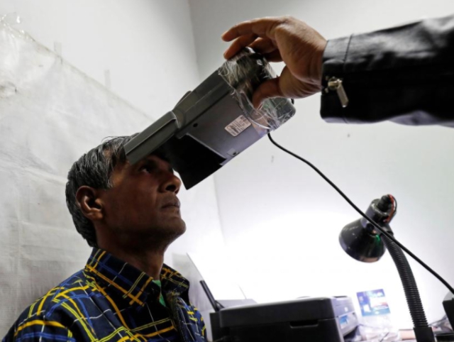 A man goes through the process of eye scanning for the Unique Identification (UID) database system, also known as Aadhaar, at a registration centre in New Delhi. PHOTO: Reuters