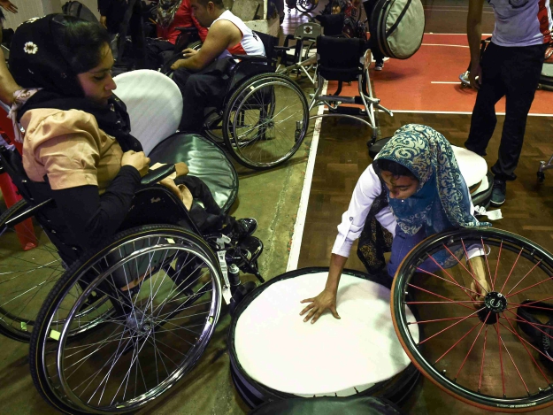 Members of Afghanistan's wheelchair basketball teams put their custom wheels away after a training session. PHOTO: AFP