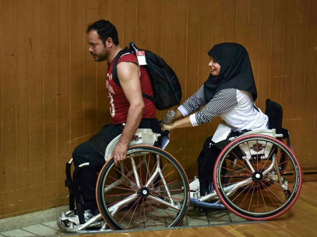 Members of Afghanistan's wheelchair basketball teams leaves the court during the qualifying tournament for the Asia Para Games in Bangkok. PHOTO: AFP