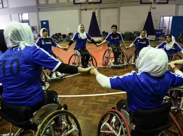 Members of Afghanistan's women's wheelchair basketball team gathers during a training session in the coastal province of Chonburi. PHOTO: AFP