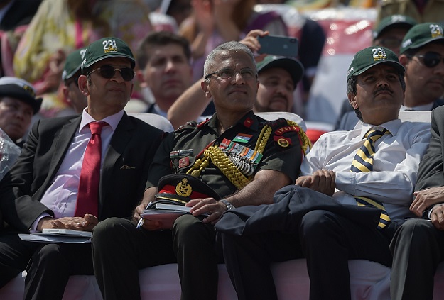 An Indian delegation including Indian Army officer Sanjay Vishwasrao (C) watch the Pakistan Day military parade in Islamabad on March 23, 2018. PHOTO: REUTERS
