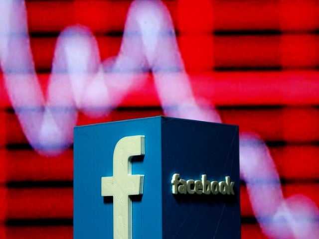 a 3d printed facebook logo is seen in front of a displayed stock graph in this illustration taken november 3 2016 photo reuters