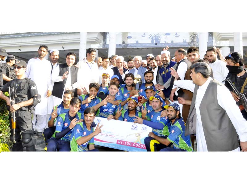 k p governor iqbal zafar jhagra with the fata super league winning team khyber green azmeri players photo express