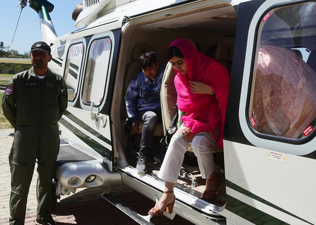 Malala Yousafzai comes out from an helicopter upon her arrival at the all-boys Swat Cadet College Guli Bagh, during her hometown visit, some 15 kilometres outside of Mingora. Photo: AFP