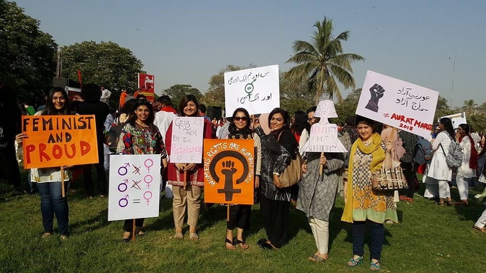 Women rights activists carry placards campaigning for empowerment and rights - Photo Courtesy Hija Kamran