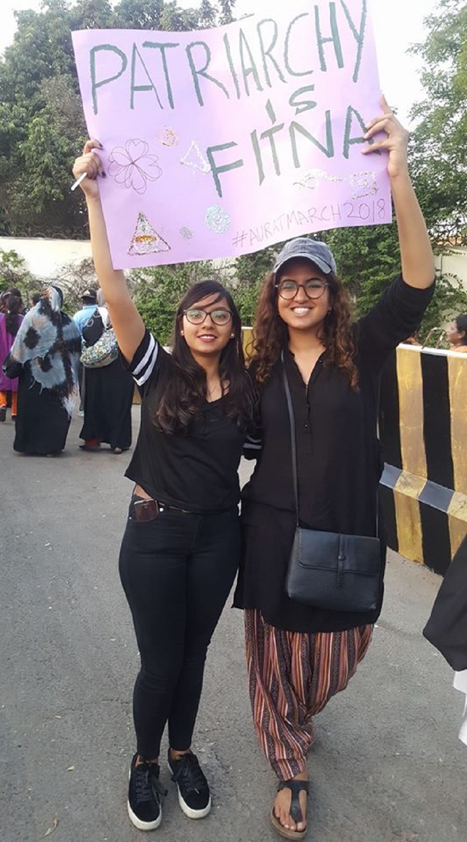 Women activists challenge patriarchy with placards - Photo Courtesy Hija Kamran 