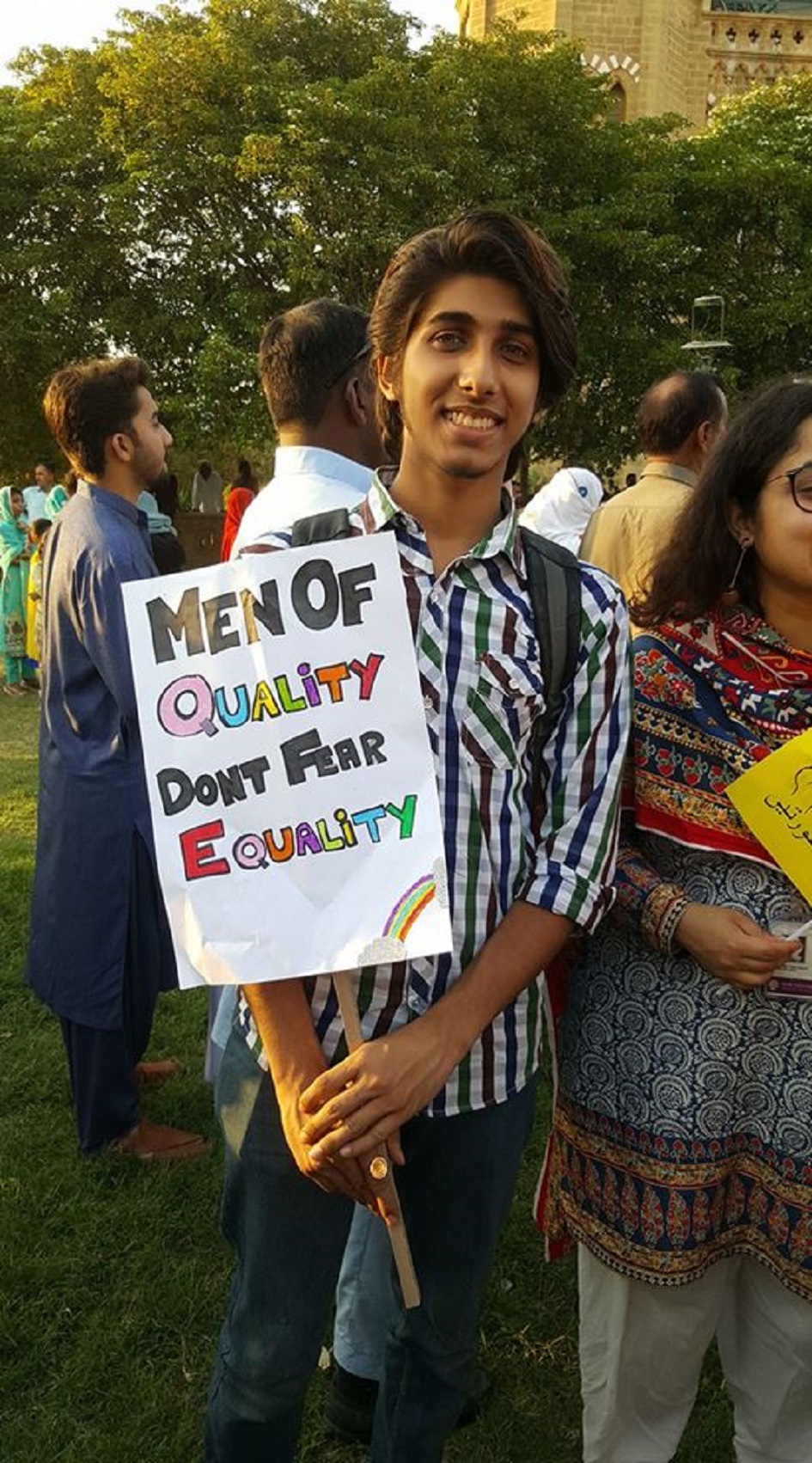 Male campaigner shows solidarity with a sign calling for more men to embrace of equality instead of fearing it - Photo Courtesy Hija Kamran