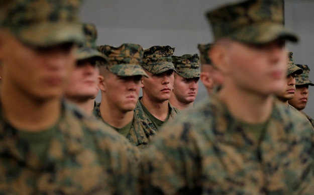 US Marines stand aboard the USS Bonhomme Richard amphibious assault ship on the the Pacific Ocean off the coast of Sydney. Australia's defence minister says the US will deploy a record number of Marines to train in Australia. PHOTO: Reuters/ File