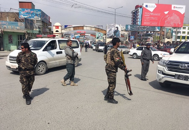 Afghan security forces keep watch near the site of an explosion in Kabul on March 9, 2018. A suicide bomber on foot blew himself up in Kabul's Shiite area on March 9, 2018, killing at least seven people, officials said, in the latest attack in the Afghan capital PHOTO: AFP