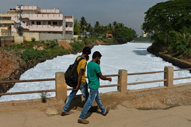 Many of the city's lakes have been concreted over to build apartment blocks, while others that remain are heavily polluted. PHOTO: AFP