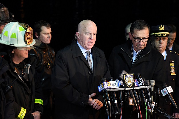 NYPD Commissioner James O'Neill (C) speaks during a press conference alongside FDNY Commissioner Daniel Nigro (2nd R) after a chartered Liberty Helicopters helicopter crashed into the East River in New York, US, March 11, 2018. PHOTO: Reuters