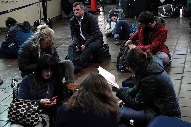 Travelers wait for Amtrak to resume its service March 2, 2018 at Union Station in Washington, DC. Amtrak has cancelled all service on its Northeast Corridor from Washington, DC to Boston until tomorrow due to multiple weather related issues. PHOTO: AFP