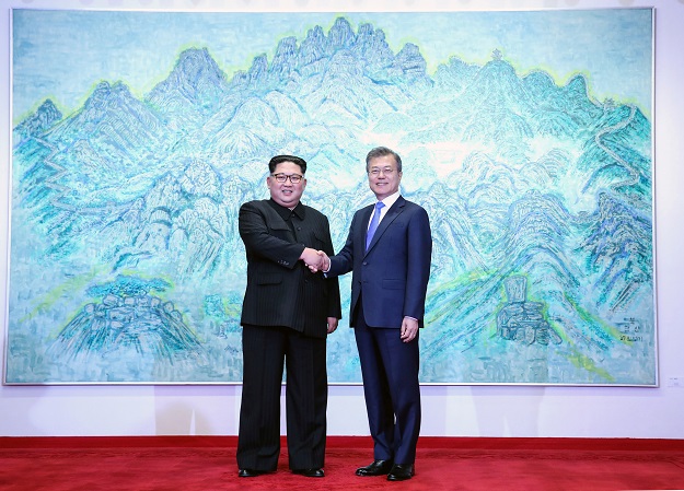  South Korean President Moon Jae-in shakes hands with North Korean leader Kim Jong Un during their meeting at the Peace House at the truce village of Panmunjom inside the demilitarized zone separating the two Koreas, South Korea, April 27, 2018. PHOTO: REUTERS