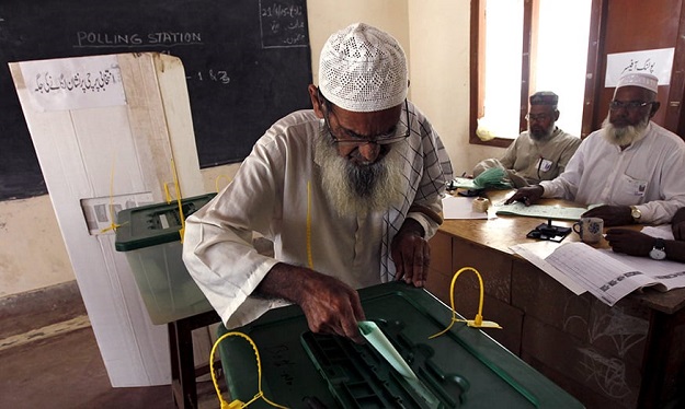 A man casts his vote at a polling station during the by-election for the seat in the National Assembly's lower house of parliament, in Karachi April 23, 2015. PHOTO: REUTERS