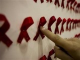 a-man-points-at-an-artwork-at-a-conceptual-art-exhibition-about-hivaids-in-tehran-2-2-3