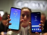 a-hostess-shows-up-samsungs-new-s9-r-and-s9-plus-devices-after-a-presentation-ceremony-at-the-mobile-world-congress-in-barcelona