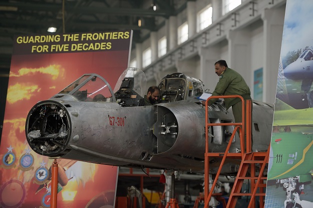 In this picture taken on December 27, 2017, technicians work on a Mirage aircraft during a full overhaul by the Pakistan Air Force (PAF) at the Mirage Rebuild Factory (MRF) in Kamra, west of the capital Islamabad.  PHOTO: AFP