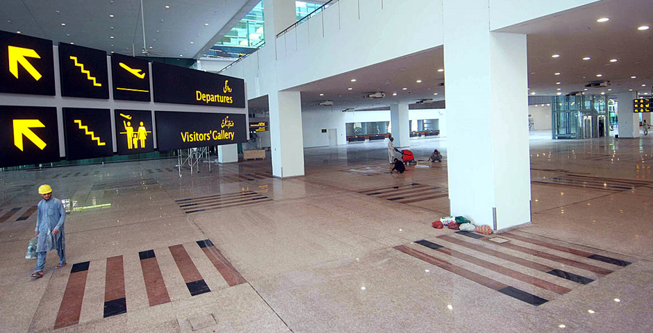 labourers giving final touches to the newly constructed international airport. Photo: APP 