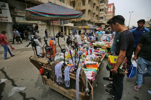 Iraqi street vendors display their products in Baghdad, where the population have swelled from 4.7 million in 2003 to 7.2 million inhabitants in 2018. PHOTO: AFP