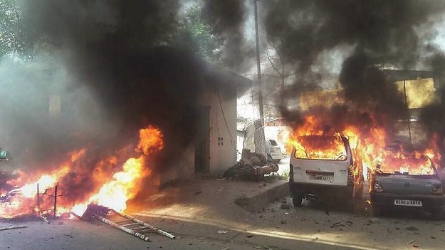 Vehicles set on fire by a group of protesters in Meerut. PHOTO: AFP