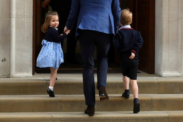 Earlier Monday Princess Charlotte turned to wave at the media as she was led into the hospital with her brother Prince George by their father Prince William to see their mother and their new baby brother. PHOTO: AFP