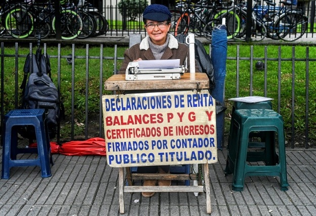 Candelaria Pinilla de Gomez, 63, has been working as a street clerk in Bogota for some 40 years. PHOTO: AFP