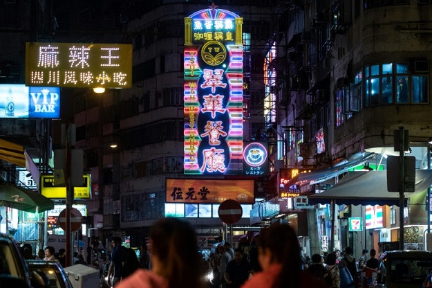 Neon has come to define the urban landscape in Hong Kong, with huge flashing signs protruding horizontally from the sides of buildings. PHOTO: AFP