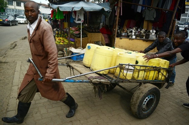 The lack of running water in Kenya's poorest neighbourhoods has meant a living for Samson Muli, a water seller in Nairobi's Kibera slum. PHOTO: AFP