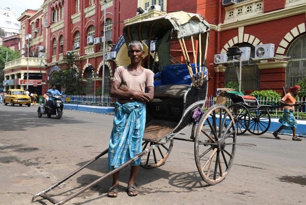 Mohammad Ashgar is one of the remaining Indian rickshaw pullers undertaking the gruelling trade. PHOTO: AFP