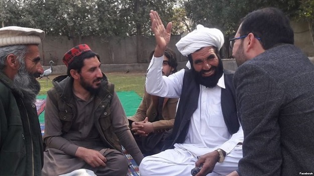 Manzoor Pashteen (second from left), the leader of the Pashtun movement, is seen wearing a red and black hat, being called a 