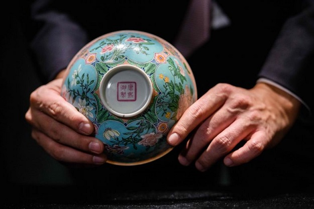 The bowl, just under 14.7cm in diameter, is decorated with falangcai - painted enamels combining Chinese and Western techniques - and flowers, including daffodils which are not typically depicted on Chinese porcelain. PHOTO: AFP