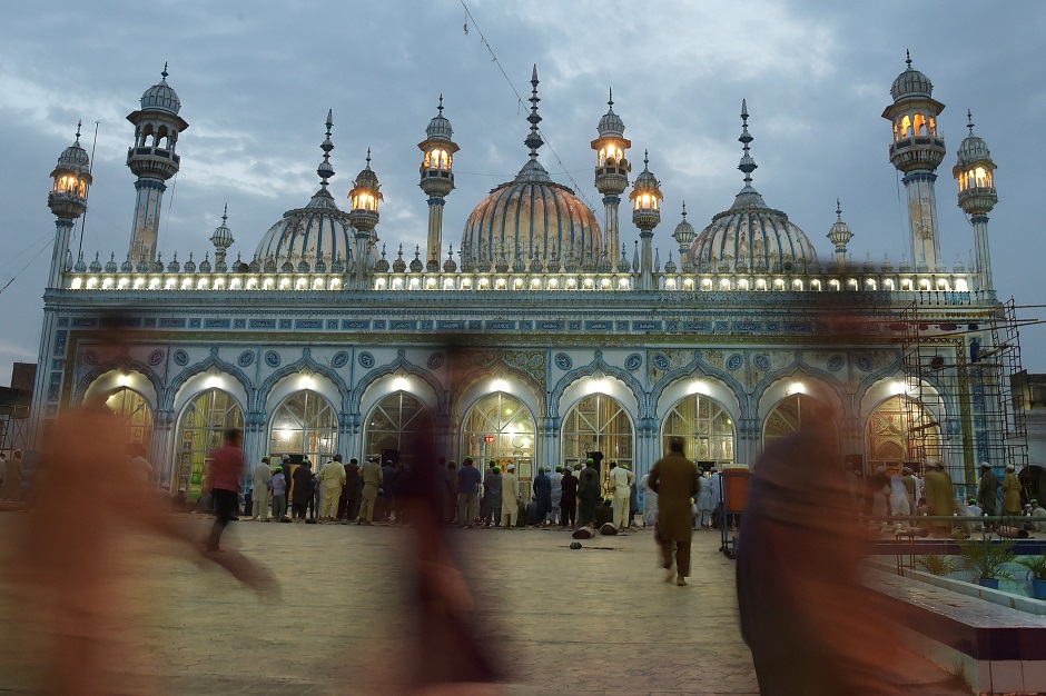 Pakistani Muslim prepare to offer prayers after breaking their fast at the Jamia Mosque in Rawalpindi. PHOTO: REUTERS