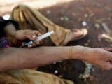 a-man-injects-heroin-into-his-arm-along-a-street-in-man-sam-northern-shan-state-myanmar-3-2-2-2