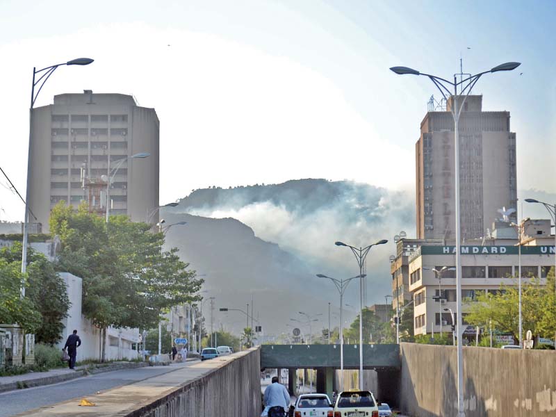 smoke rises from the wildfire on margalla hill photo waseem nazir express