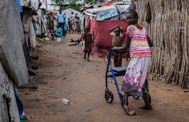 eleven years old nyamet steven who was born with cerebral palsy walks with a walker at mahad camp for internally displaced people idp in juba on april 17 2018 the camp opened in 2014 shortly after the civil war broke out in the country around 7000 people of diverse ethnic backgrounds live in the camp over 200 of them live with a disability photo afp