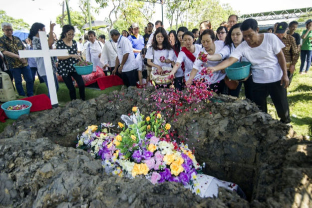 Friends and relatives attend funeral of Martha Djumani. PHOTO: AFP
