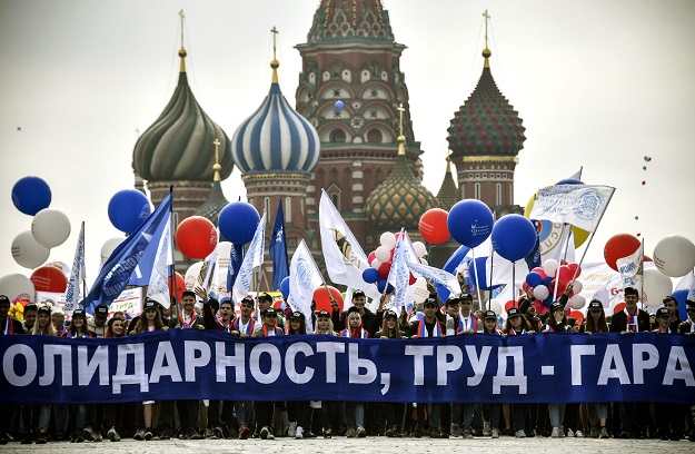Russian Trade Unions' members holding balloons and flags parade on Red Square during their May Day demonstration in Moscow. PHOTO: AFP