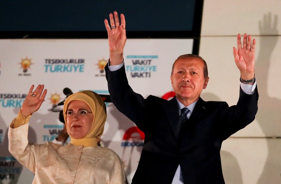  Turkish President Tayyip Erdogan and his wife Emine Erdogan greet supporters gathered in front of the AKP headquarters in Ankara, Turkey. PHOTO: REUTERS