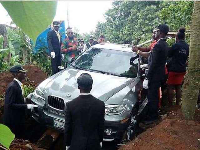 Image result for Nigerian man buries father in brand new BMW car