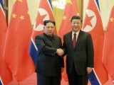 north-korean-leader-kim-jong-un-shakes-hands-with-chinese-president-xi-jinping-as-he-paid-an-unofficial-visit-to-china