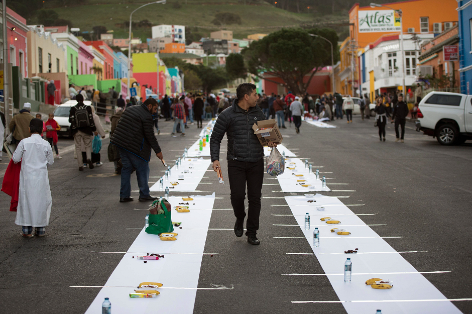 Iftaar is set up for hundreds of people in Bo Kaap, Cape Town. PHOTO: AFP/ Rodger Bosch. 