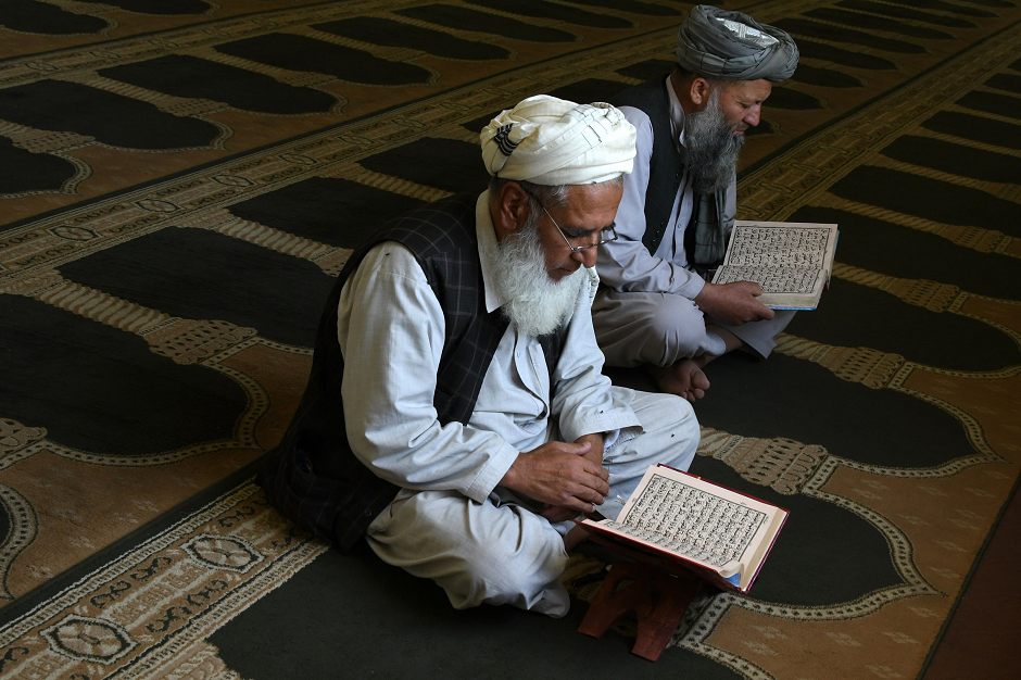 An Afghan man reads the Quran during Ramazan in the Ghazni province. PHOTO: AFP/ Zakeria Hashimi.