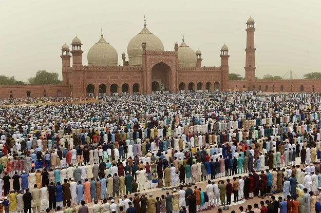 Pakistani Muslim worshippers pray to mark Eid al-Fitr at the Badshahi Mosque in Lahore on June 16, 2018. Muslims around the world are celebrating the Eid festival, marking the end of the fasting month of Ramadan PHOTO: AFP