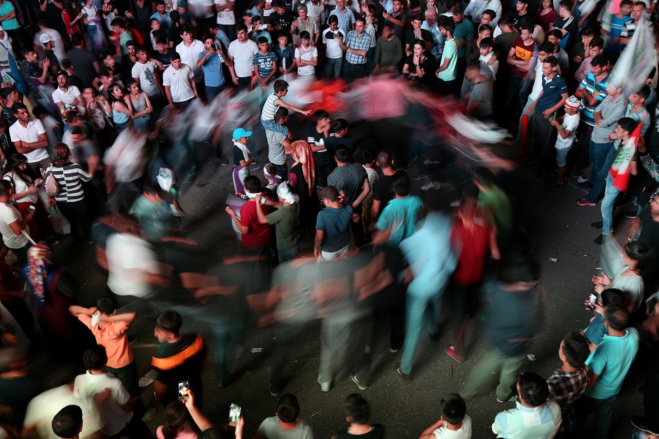  Supporters of pro-Kurdish Peoples' Democratic Party (HDP) dance as they celebrate in Diyarbakir, Turkey. PHOTO: REUTERS 