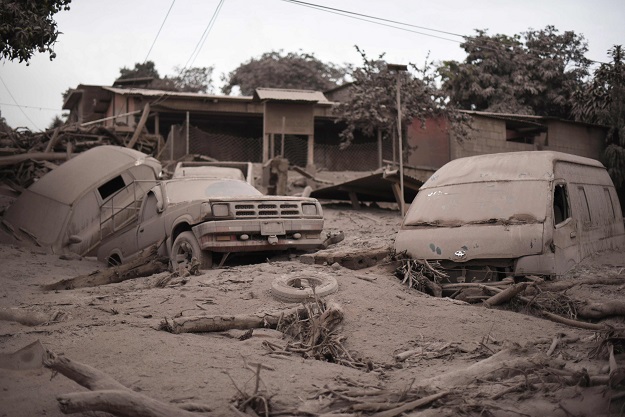 View of the damage casued by the eruption of the Fuego Volcano in San Miguel Los Lotes, a village in Escuintla Department, about 35 km southwest of Guatemala City, on June 4, 2018. At least 25 people were killed, according to the National Coordinator for Disaster Reduction (Conred), when Guatemala's Fuego volcano erupted Sunday, belching ash and rock and forcing the airport to close. PHOTO: AFP