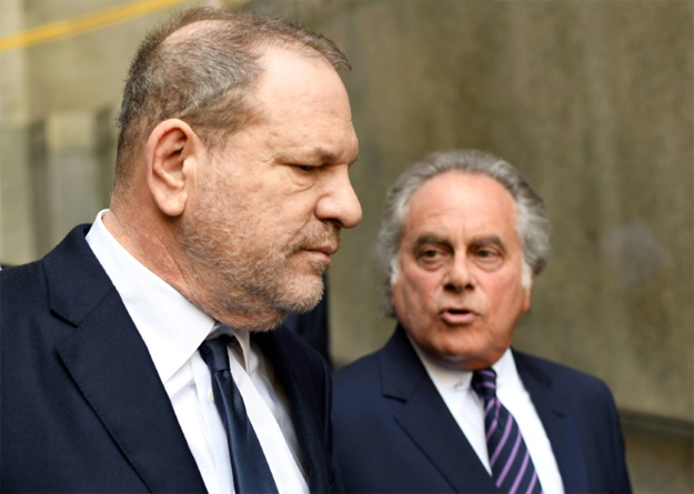 Weinstein leaves Manhattan criminal court with his lawyer Benjamin Brafman (R) -- one of America's most celebrated criminal defense attorneys PHOTO: AFP