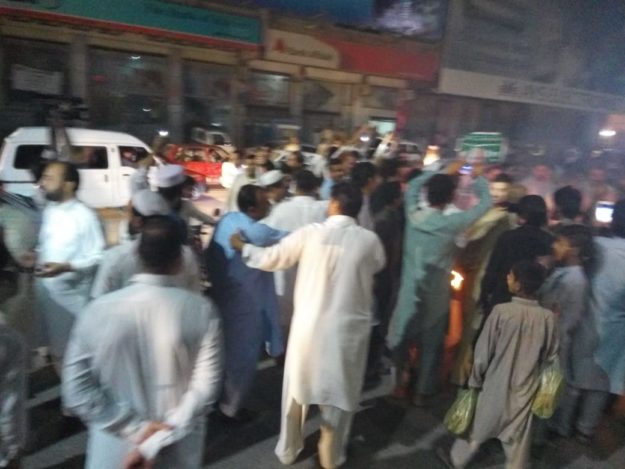Protesters at Bab-e-Peshawar road. PHOTO: EXPRESS