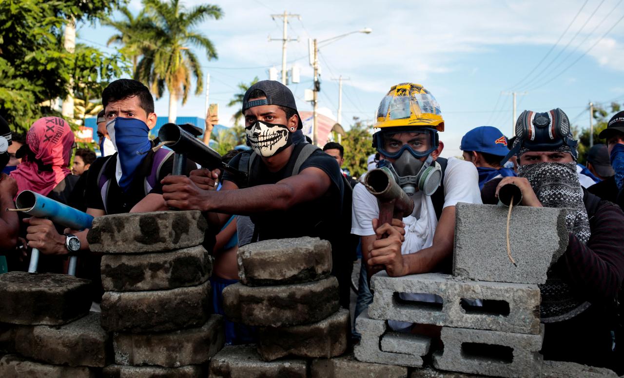 demonstrators-stand-behind-a-barricade-during-clashes-with-riot-police-during-a-protest-against-nicaraguas-president-daniel-ortegas-government-in-managua-2