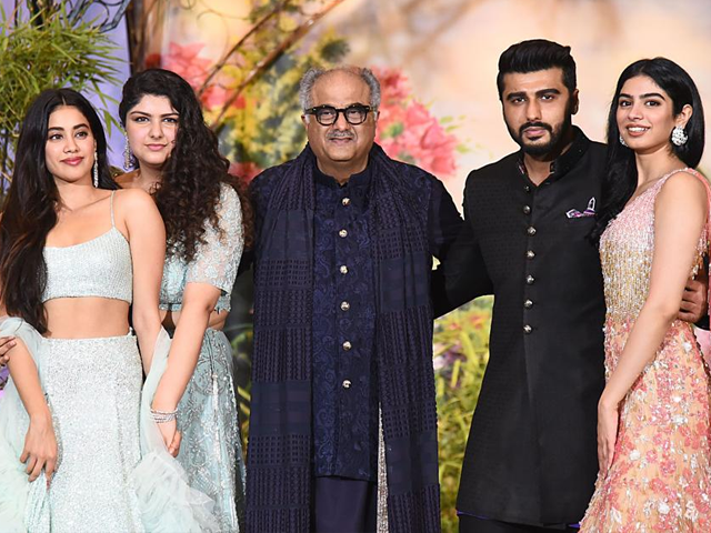 ndian Bollywood film producer and director Boney Kapoor (C) poses for a picture with his daughters Janhvi Kapoor (L), Anshula Kapoor (2L) and Khushi Kapoor (R) and son Arjun Kapoor (2L) during the wedding reception of actress Sonam Kapoor and businessman Anand Ahuja in Mumbai. (AFP)