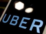 file-photo-the-logo-of-uber-is-seen-on-an-ipad-during-a-news-conference-to-announce-uber-resumes-ride-hailing-service-in-taipei-2